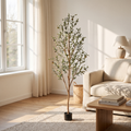 Potted artificial olive tree in a bright living room